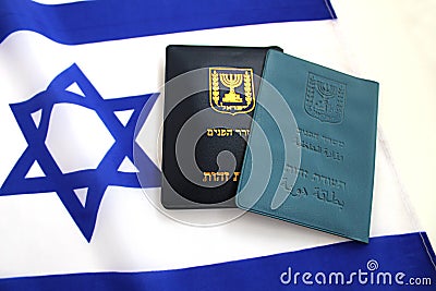 Two booklet covers of Israeli identity card on Flag of Israel.Passport of a citizen. Passport Israel on flag Israel Stock Photo