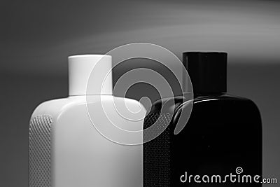 Two bottles of man perfume on grey background Stock Photo