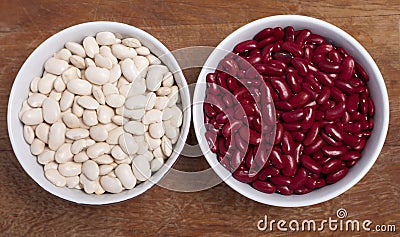 Two bowls with red and white kidney beans Stock Photo