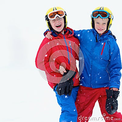 Two boys enjoying winter ski vacation Stock Photo