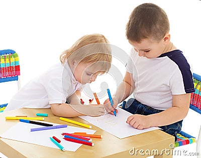 Two boys enthusiastically paint markers Stock Photo