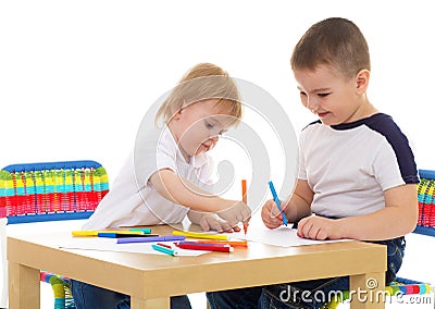 Two boys enthusiastically paint markers Stock Photo