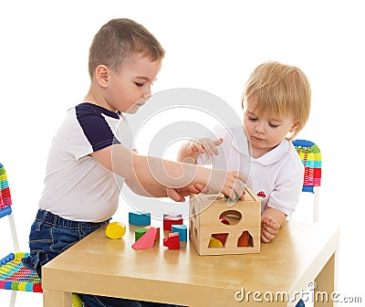 Two boys enthusiastically paint markers Stock Photo