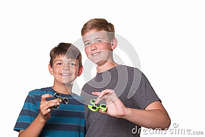 Two boys holding fidget spinners Stock Photo