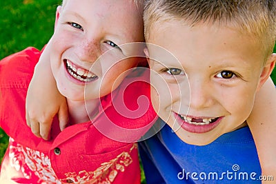 Two Boys Hugging Stock Photo
