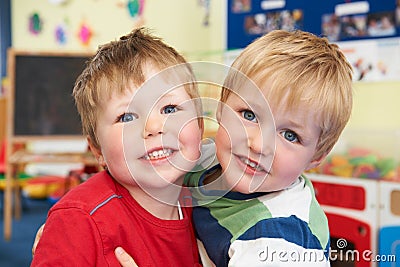 Two Boys Hugging One Another At Pre School Stock Photo