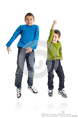 Two boys jumping on white background. Stock Photo