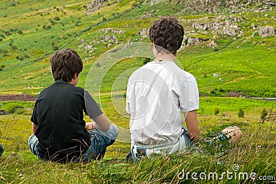 Two boys looking at a beautiful landscape Stock Photo
