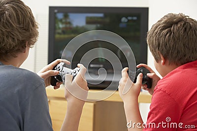 Two Boys Playing With Game Console Stock Photo