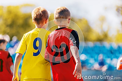 Two Boys Soccer Players in Colourful Jersey Shirts. Kids Children Compete in Sports Competition Editorial Stock Photo