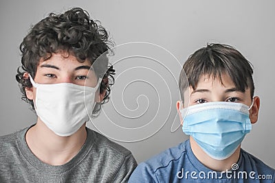 Two Boys with Masks, Lockdown Pandemic, Flu, Protection Stock Photo