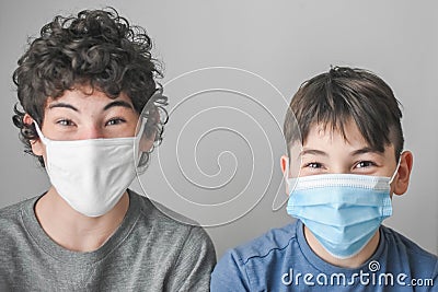 Two Boys with Masks, Lockdown Pandemic, Flu, Protection Stock Photo