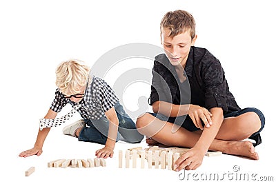 Two boys with wooden bricks Stock Photo