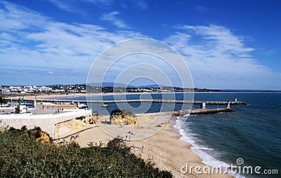 Batata beach English: Potato beach and entrance to the marina in Lagos, Algarve, Portugal. Stock Photo