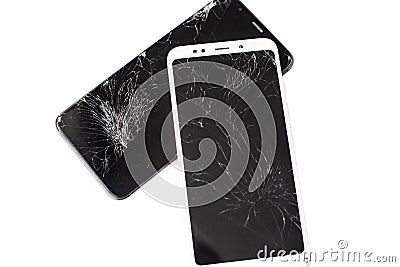 Two broken phones of white and black on a white background. cracked touchscreen glass of the touch screen isolate Stock Photo