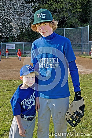 Two players after a Little League game.. Editorial Stock Photo