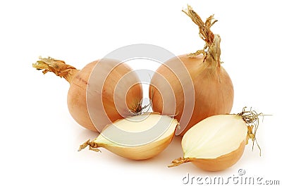 Two brown onions and a cut one Stock Photo