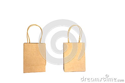 Two brown paper shopping bags with hands isolated on white background Stock Photo