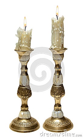 Two burning old candles in Golden candlesticks Stock Photo