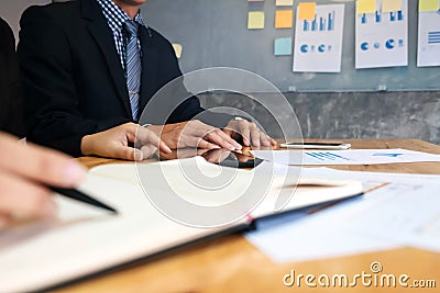 two business executives meeting analyzing data paper at workplace Stock Photo