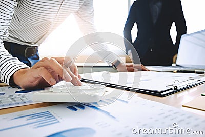 two Business executives partner analysis data document with accountant at office place Stock Photo