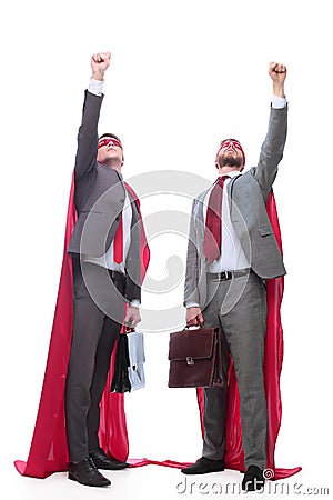 Two business leaders in superhero capes standing together. Stock Photo