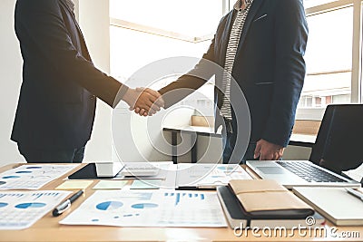 Two business men shaking hands during a meeting to sign agreement and become a business partner, enterprises, companies, confident Stock Photo