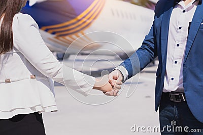 Two business man and woman making handshake in the city. Business etiquette, congratulation, merger and acquisition concepts Stock Photo