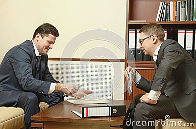 Two business people direct negotiations in the office Stock Photo