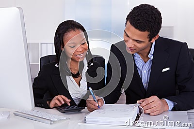 Two business people doing finance work Stock Photo