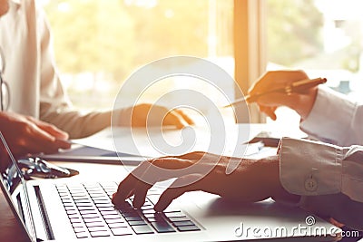 Two business people teamwork working near window in office room Stock Photo