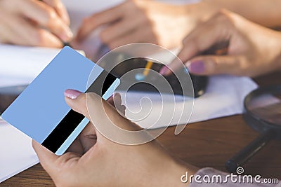 Two business woman hand counting on calculator and holding credit card ,debt collection and shopping online Stock Photo