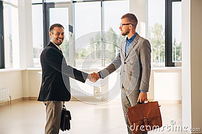 Two businessman shake hands Stock Photo