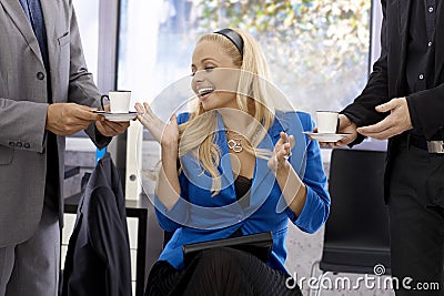 Two businessmen courting pretty businesswoman Stock Photo