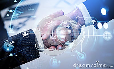 Two businessmen in formal suits shake hands with each other Stock Photo