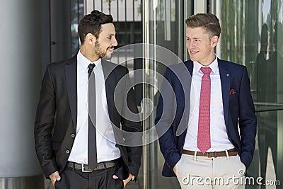 Two businessmen greeting each other outside Stock Photo