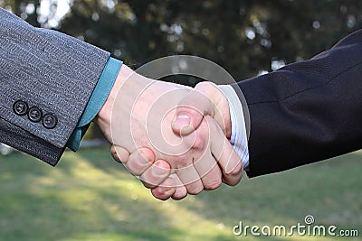 Two businessmen hands handshake Stock Photo