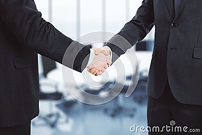 Two businessmen shake hands Stock Photo