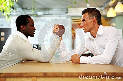 Two businessmen sitting opposite each other Stock Photo