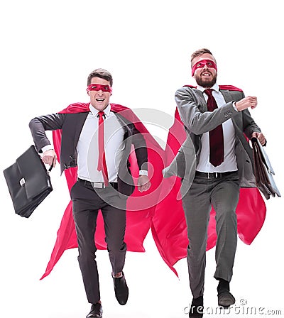 Two businessmen in superhero capes running forward Stock Photo