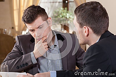 Two businessmen talking about an offer Stock Photo