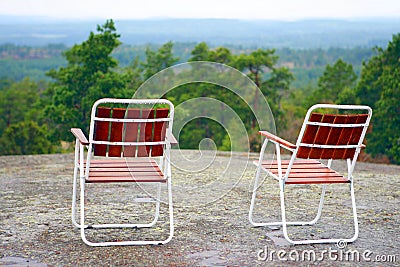 Two campchairs waiting on mountaintop Stock Photo