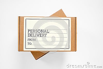 Two cardboard boxes for parcels, one above the other, with blank label written about personal delivery and copy space for any text Stock Photo
