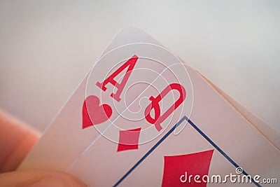 Two cards ace and queen, Playing cards in hand on the table, poker nands Stock Photo