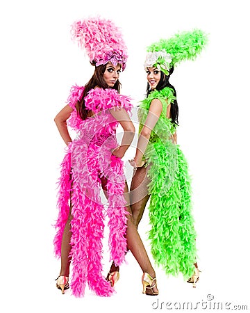Two carnival dancer women dancing against isolated white background Stock Photo