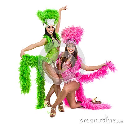 Two carnival dancer women dancing against isolated white background Stock Photo