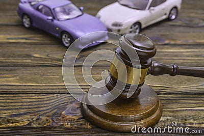 Two cars collided, an accident and a hammer of the judge. Stock Photo