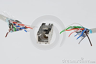 Two cat6 SMTP wires with spread ends close to female LAN Cat6 connector in steel chassis Stock Photo