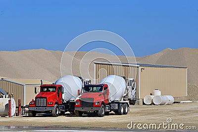 Two cement mixer trucks Stock Photo