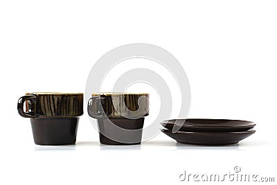 Two ceramic cups with dishes on white Stock Photo